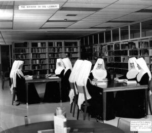 Novices from 1964 entrance class in Juniorate library Mont Marie Holyoke MA c1965